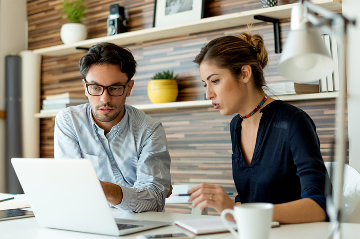 legal_services_business business couple looking at laptop